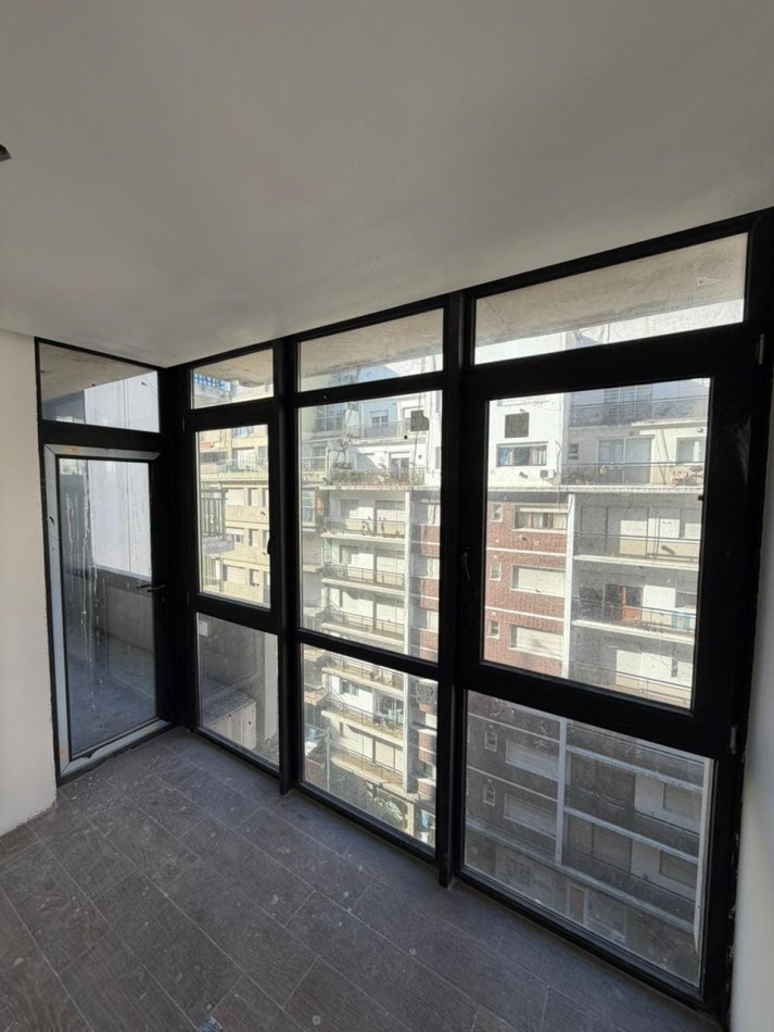 DEPARTAMENTO 2 AMBIENTES A LA CALLE MAS COCHERA EN EDIFICIO DALAI CENTRO A ESTRENAR